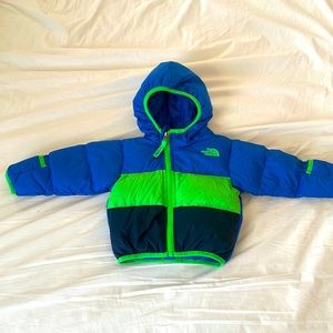 Blue/green/black North Face puffer jacket sized 6-12 months